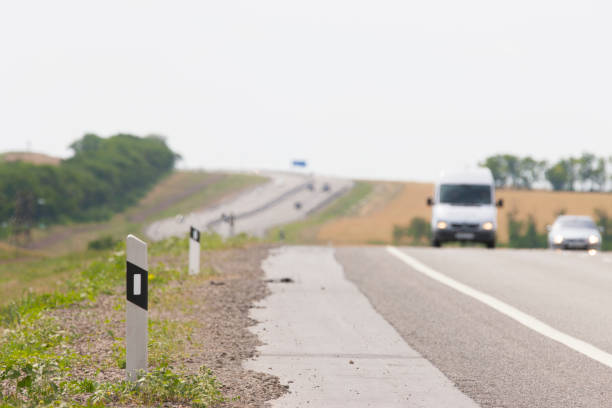 istock View from the curb on cars passing by 999014200