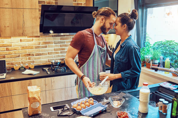 istock sensational couple cooking together 999014884