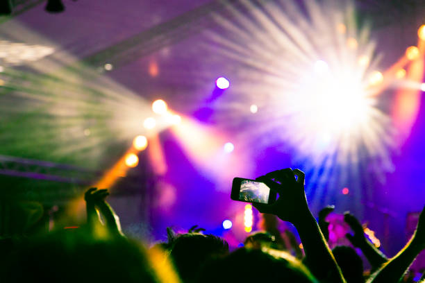 istock Filming concert on smart phone 999017416