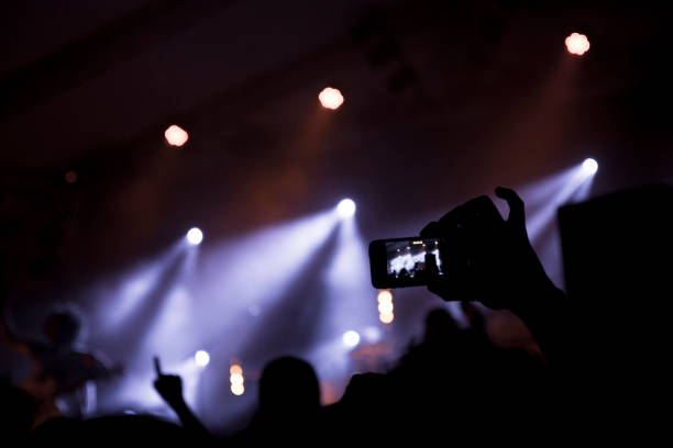 istock Filming concert on smart phone 999017588