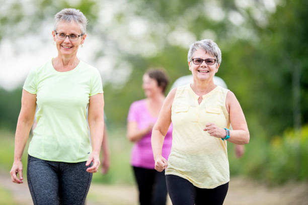 istock Seniors Walking On A Trail 999018744