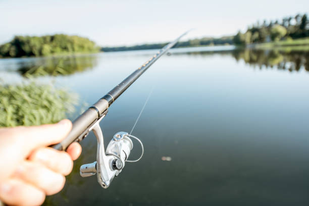 istock Fishing with rod on the lake 999022994