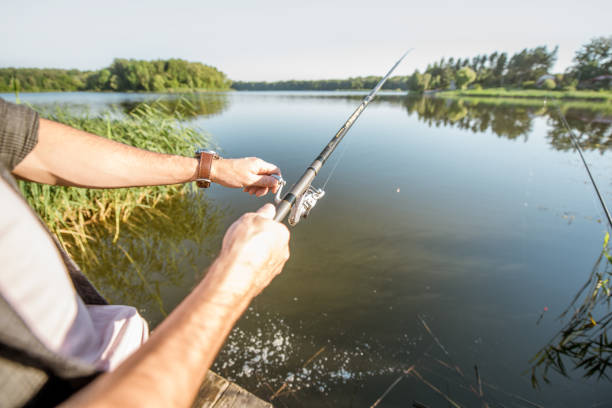 istock Fishing with rod on the lake 999025552