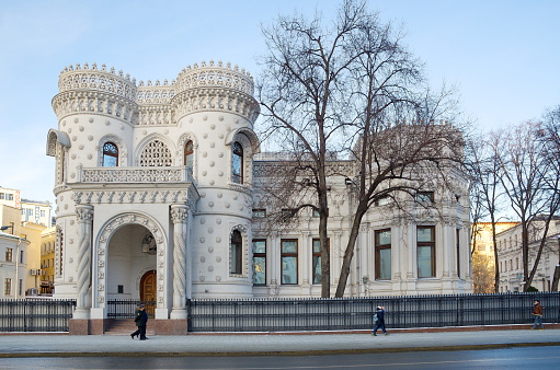 Weimar, Germany - January 03, 2021: The Anna Amalia Library (l.) and the Franz Liszt School of Music (r.) in winter on the edge of the Ilmpark.