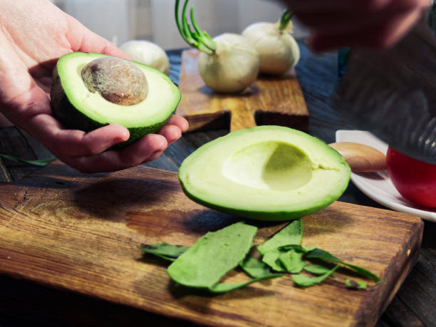 istock Cutting and peeling avocado for salad 999033494