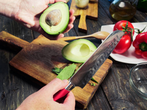 istock Cutting and peeling avocado for salad 999033518