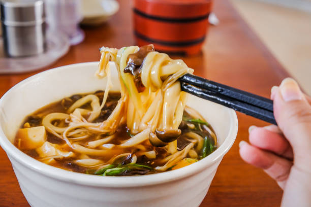 Young women eating japanese udon soup