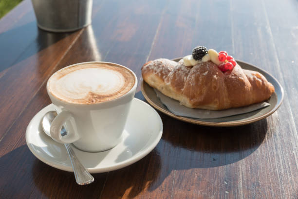 istock Breakfast at the beach with pasta and capuccino 999058480