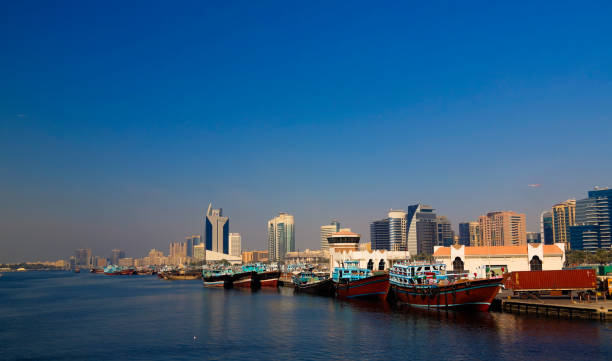 istock Panorama with arabic boats aka Dhow at Dubai creek, UAE 999066328