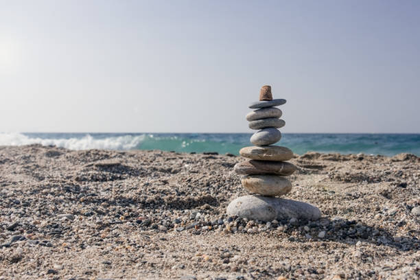 istock Balancing stones set one on top of the seashore 999073480