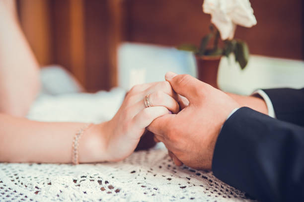 bride and groom holding hands.Declaration of Love.