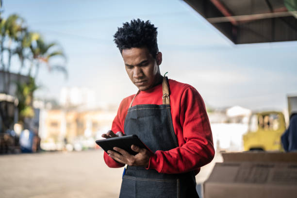 istock Man working at a inventory in a backroom storage 999084168