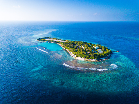 Aerial view of the tropical island in the middle of the Indian Ocean. Maldives