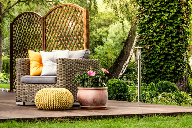 istock Pink flowers on wooden veranda 999093164