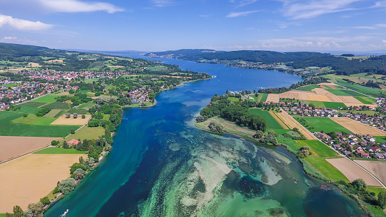 Eschenz, Switzerland - June 5, 2017: Here Lake Constance merges into the Rhine. This is the border area between Switzerland and Germany.