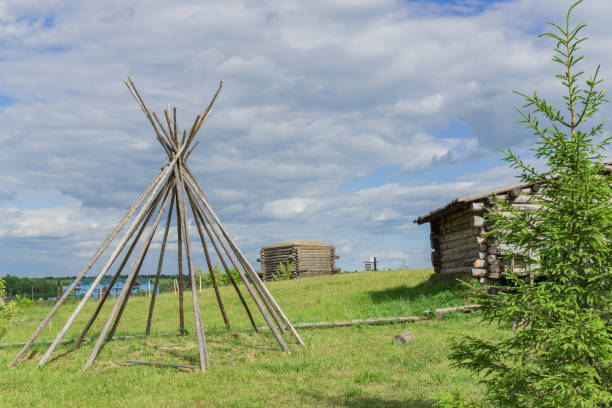 istock wooden construction on the meadow under cloudy sky. Landscape 999110880