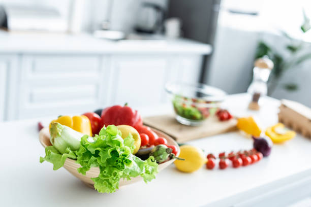 istock close-up view of fresh uncooked vegetables on kitchen table 999111206
