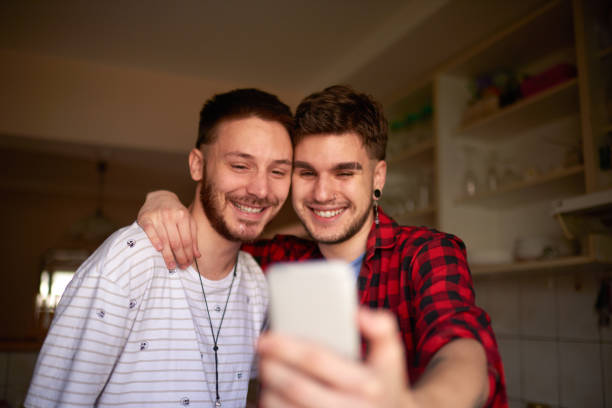 istock Gay couple taking a selfie image 999111654