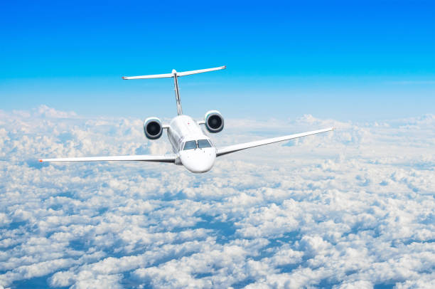istock Small passenger plane flies in the sky above the clouds. 999114380