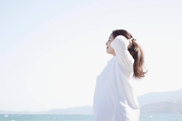 istock Woman relaxed at seaside 999115304