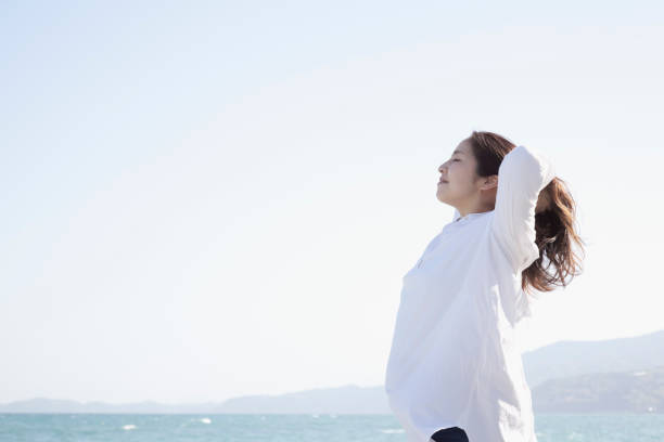 istock Woman relaxed at seaside 999115320