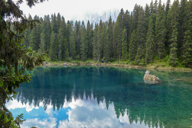 istock Lake Carezza with reflection of mountains in the Dolomites 999118932