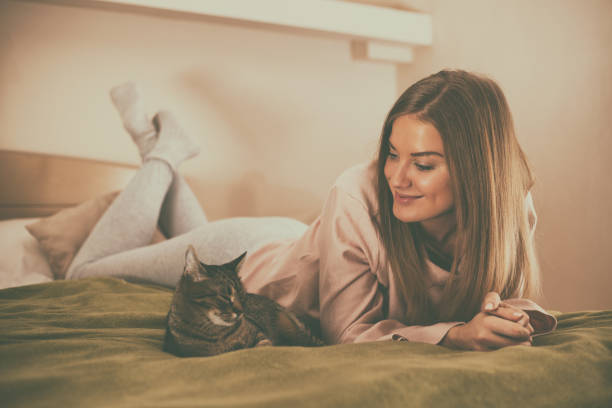 istock Happy woman with her cat 999122520