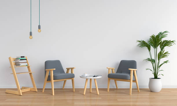 istock grey armchair in white room for mockup, 3D rendering 999128460