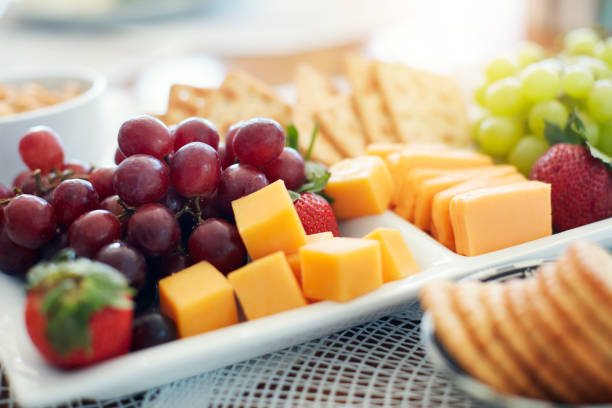Chef cook prepares dessert with fruit in the restaurant. The concept is healthy food, vegetarianism, vitamins.