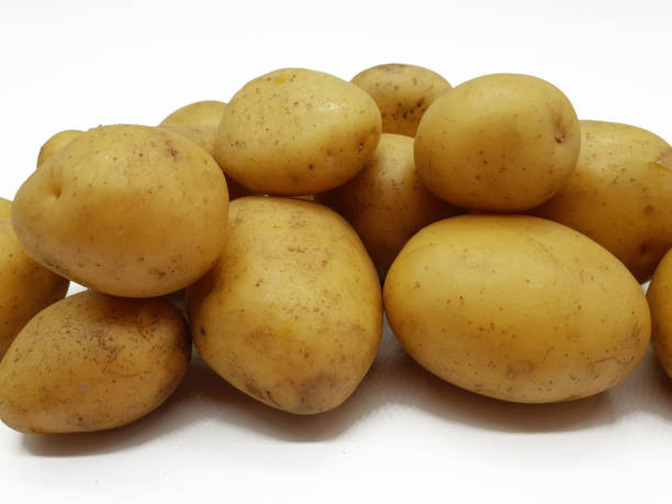 istock Fresh raw potatoes on a neutral background 999140590