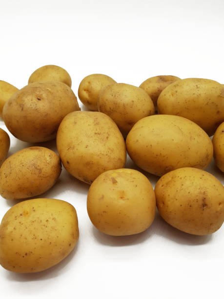 istock Fresh raw potatoes on a neutral background 999140596