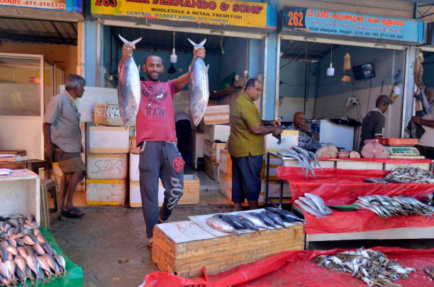 Kandy, Sri Lanka - April 7, 2018: At the bustling and colorful Kandy Municipal Central Market you can find fruit and vegetable, meat, fish, dry food, seasonings and other stuff related to food.