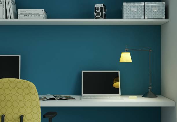 istock Modern home office with yellow chair and blue wall interior design 3d Rendering 999151944