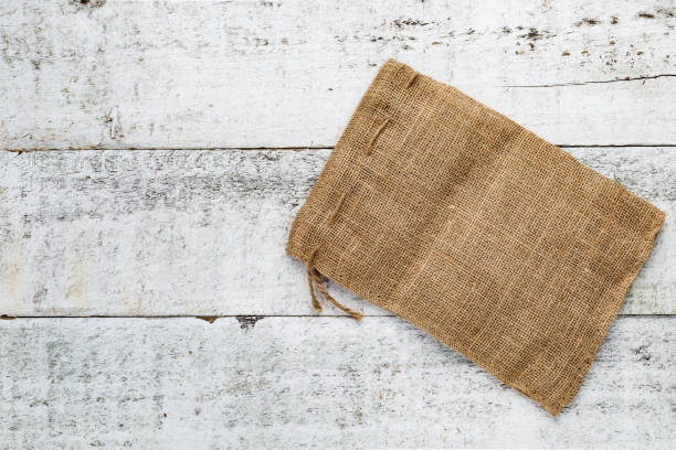 istock Weathered Wooden Boards & Burlap Sack 999192142