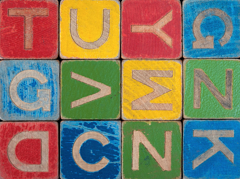 Word doxing from wooden blocks on black background