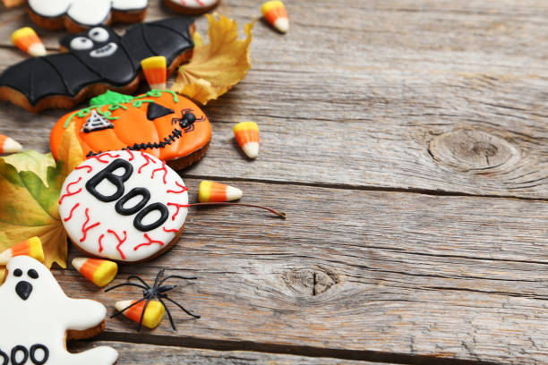 istock Fresh halloween gingerbread cookies on grey wooden table 999209658