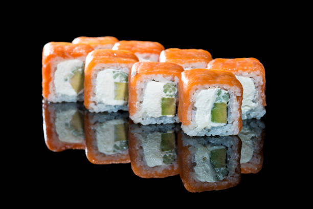 istock Delicious Philadelphia sushi rolls with rice, avocado, cream che 999216848