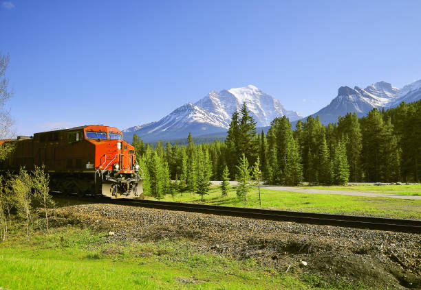 istock Freight train approaches to Lake Louise station. 999230194
