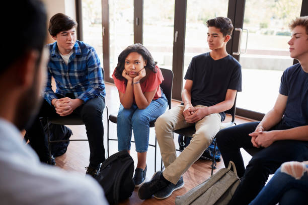 istock Unhappy Female Pupil In High School Discussion Group 999232340