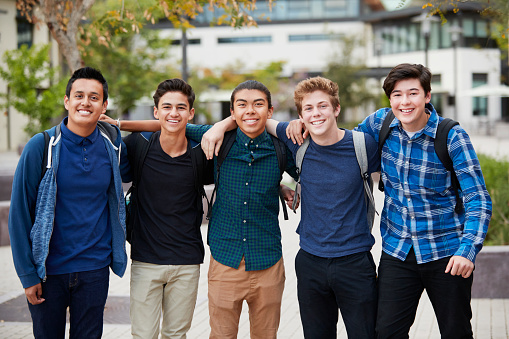Portrait Of Male High School Students Outside College Buildings
