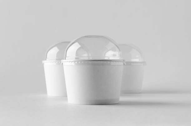 istock White ice cream paper cup mock-up with plastic lid. 999253410