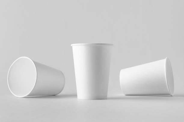 istock 12 oz. white coffee paper cup mock-up without lid. 999254074