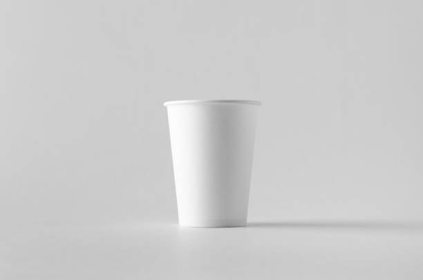 istock 12 oz. white coffee paper cup mock-up without lid. 999254124