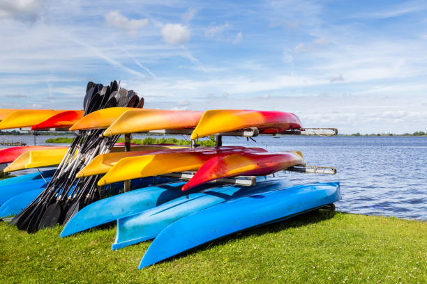 istock Water landscape with colorful rental canoes 999254178