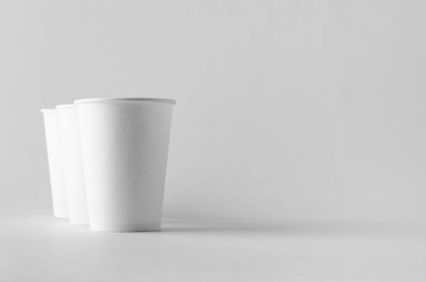 istock 12 oz. white coffee paper cup mock-up without lid. 999255034