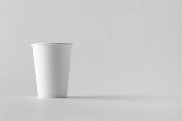 istock 12 oz. white coffee paper cup mock-up without lid. 999261998