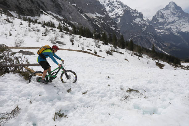 istock Mountain biker descends avalanche snow above Grindelwald 999262004