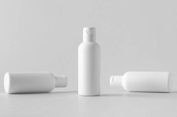 istock White plastic cosmetic lotion bottle mock-up with cap. 999283242