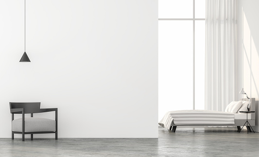 Minimal style bedroom 3d render.There are concrete floor,white wall.Finished with light gray fabric furniture,The room has large windows. Looking out to see the scenery outside.