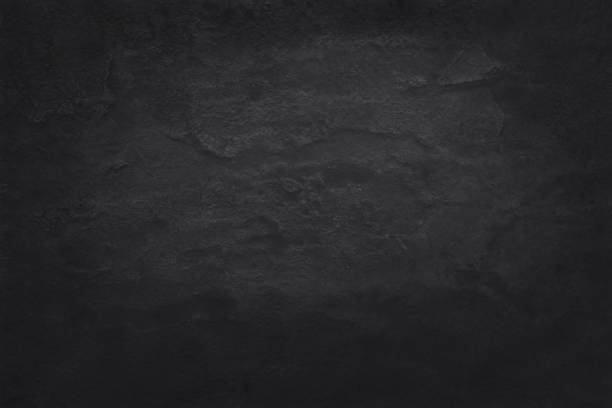 istock Dark grey black slate texture in natural pattern with high resolution for background and design art work. Black stone wall. 999313304